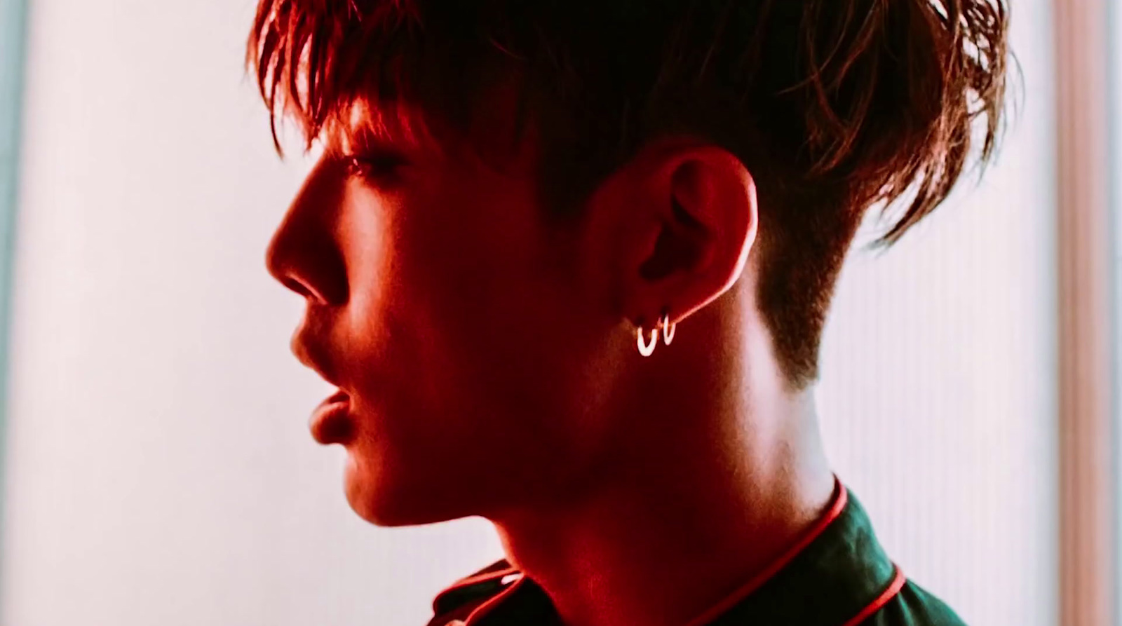 a person with a pair of earrings on their ear