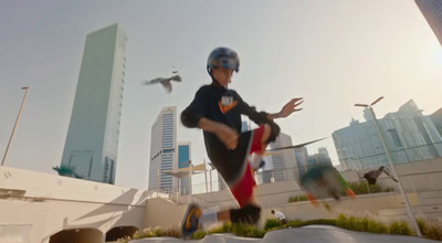 a man riding a skateboard down the side of a ramp