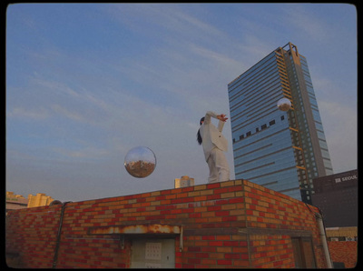 a statue of a man on top of a brick building