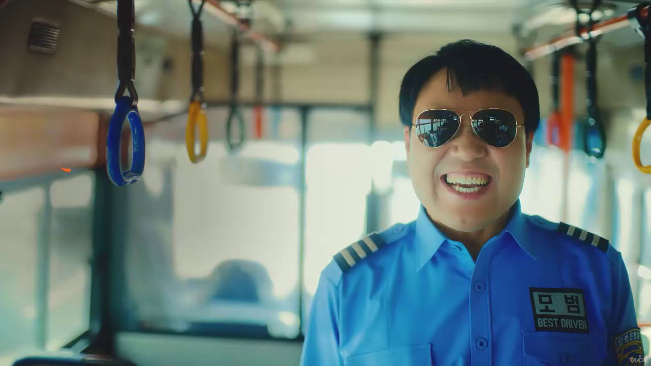 a man in a blue uniform on a bus