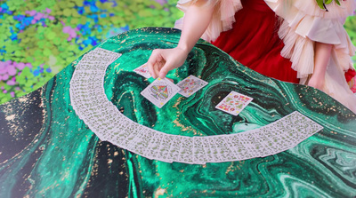 a woman in a red dress is playing cards