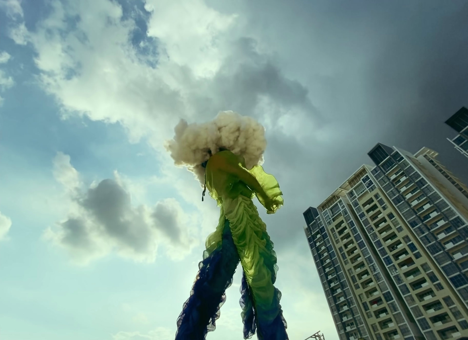 a tall building with a kite in front of it