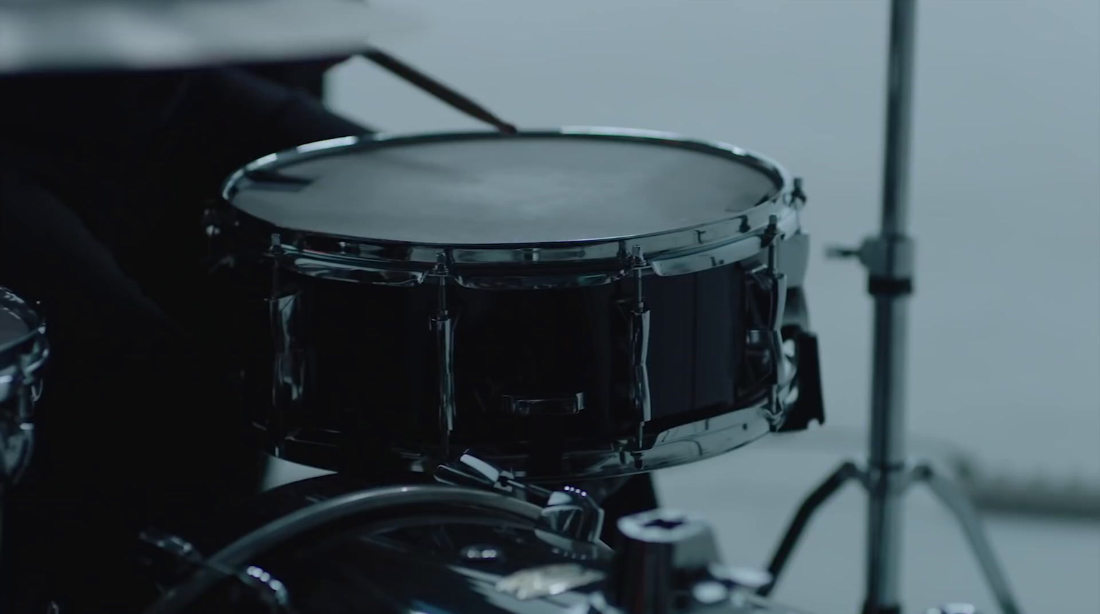 a close up of a black drum set