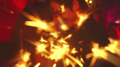 a man standing in front of a firework display