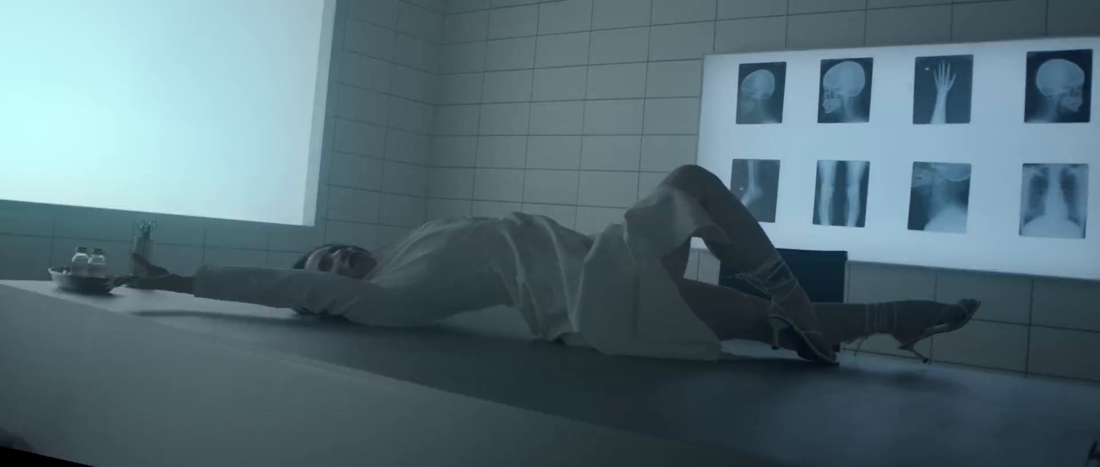 a person laying on a counter in a room