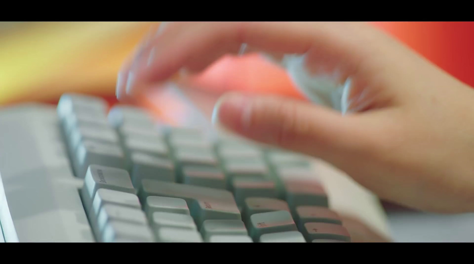 a close up of a person typing on a keyboard