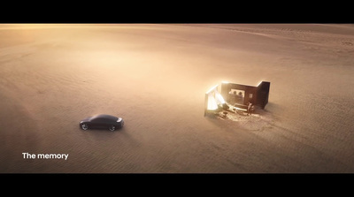 a car and a house in the middle of a desert