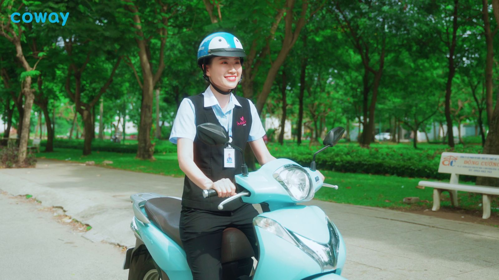 a person on a motor scooter in a park