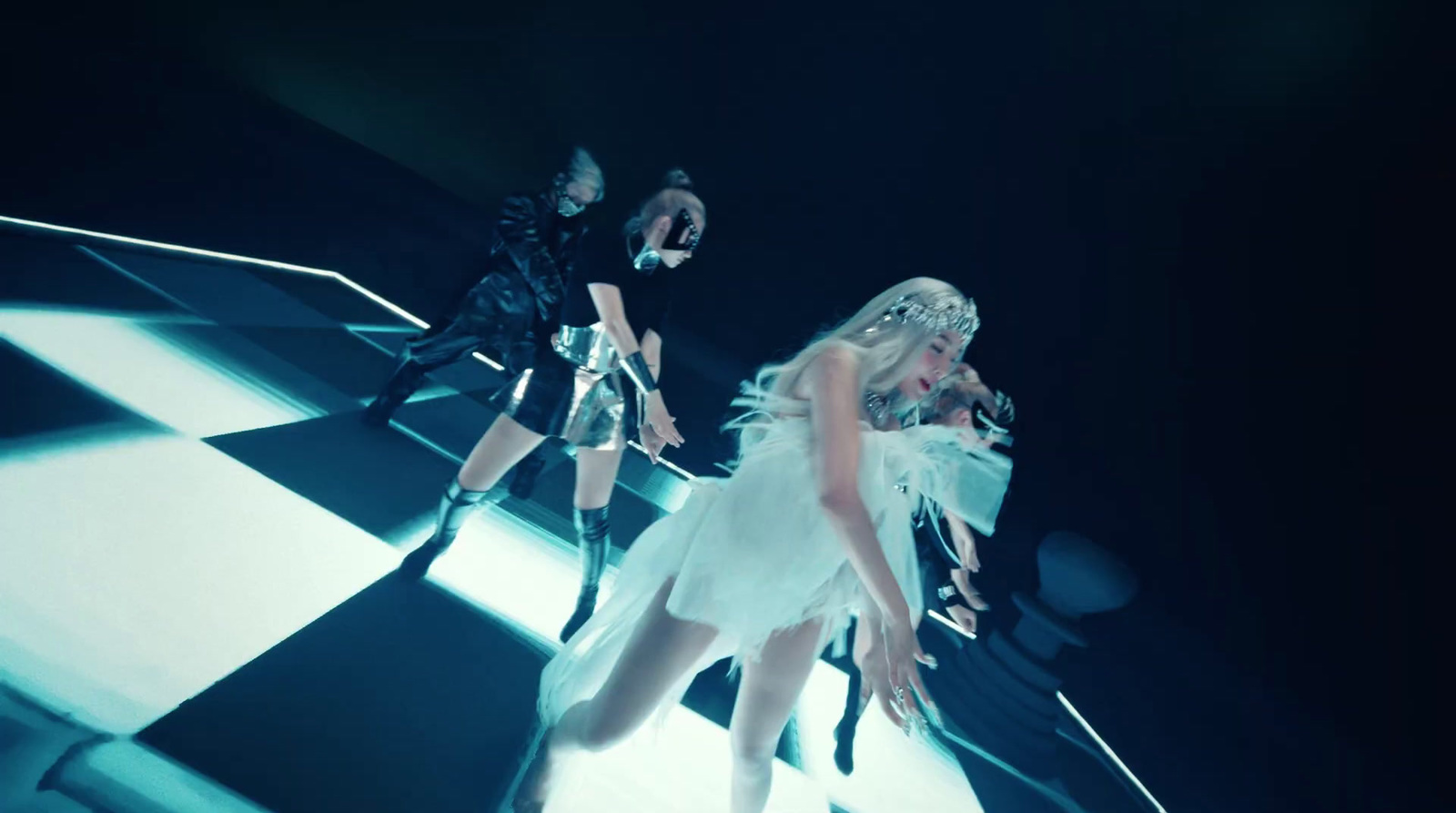 a group of women standing on top of a checkered floor