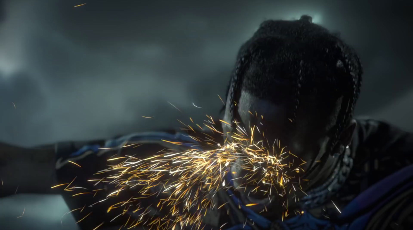 a man with dreadlocks holding a sparkler