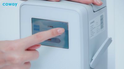 a person pressing a button on a machine