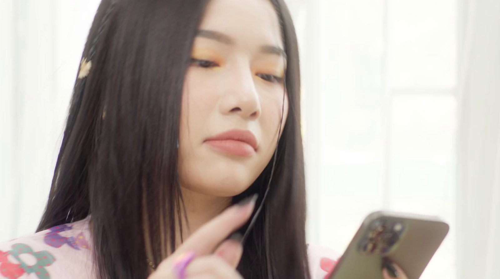 a woman is looking at her cell phone