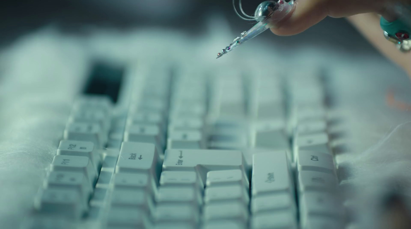 a close up of a person's hand on a computer keyboard