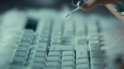 a close up of a person's hand on a computer keyboard