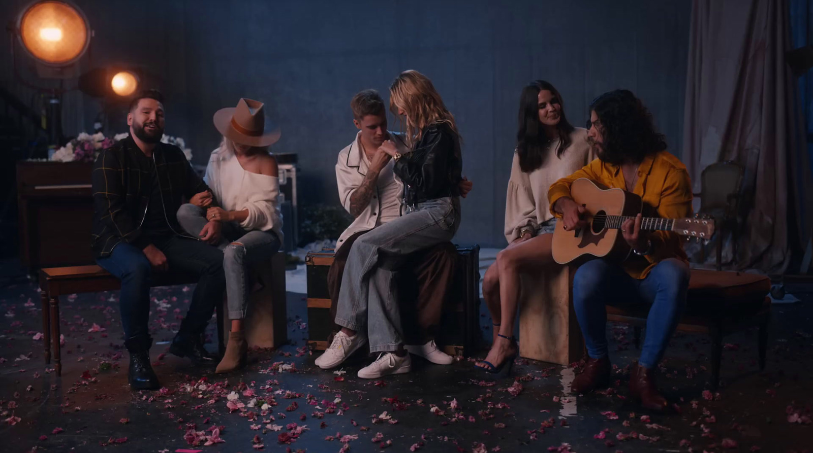 a group of people sitting around each other