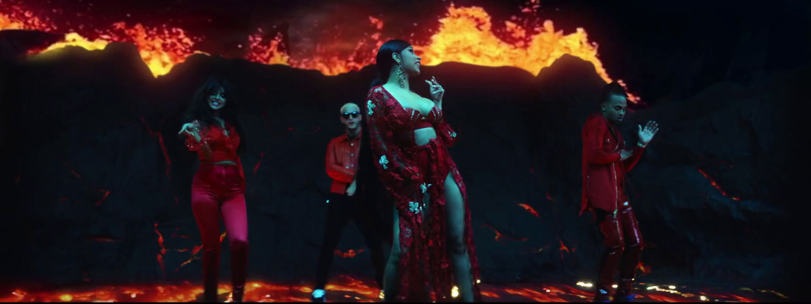 a group of women standing in front of a fire