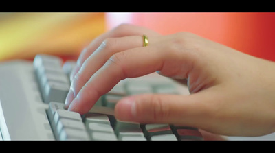 a close up of a person typing on a keyboard