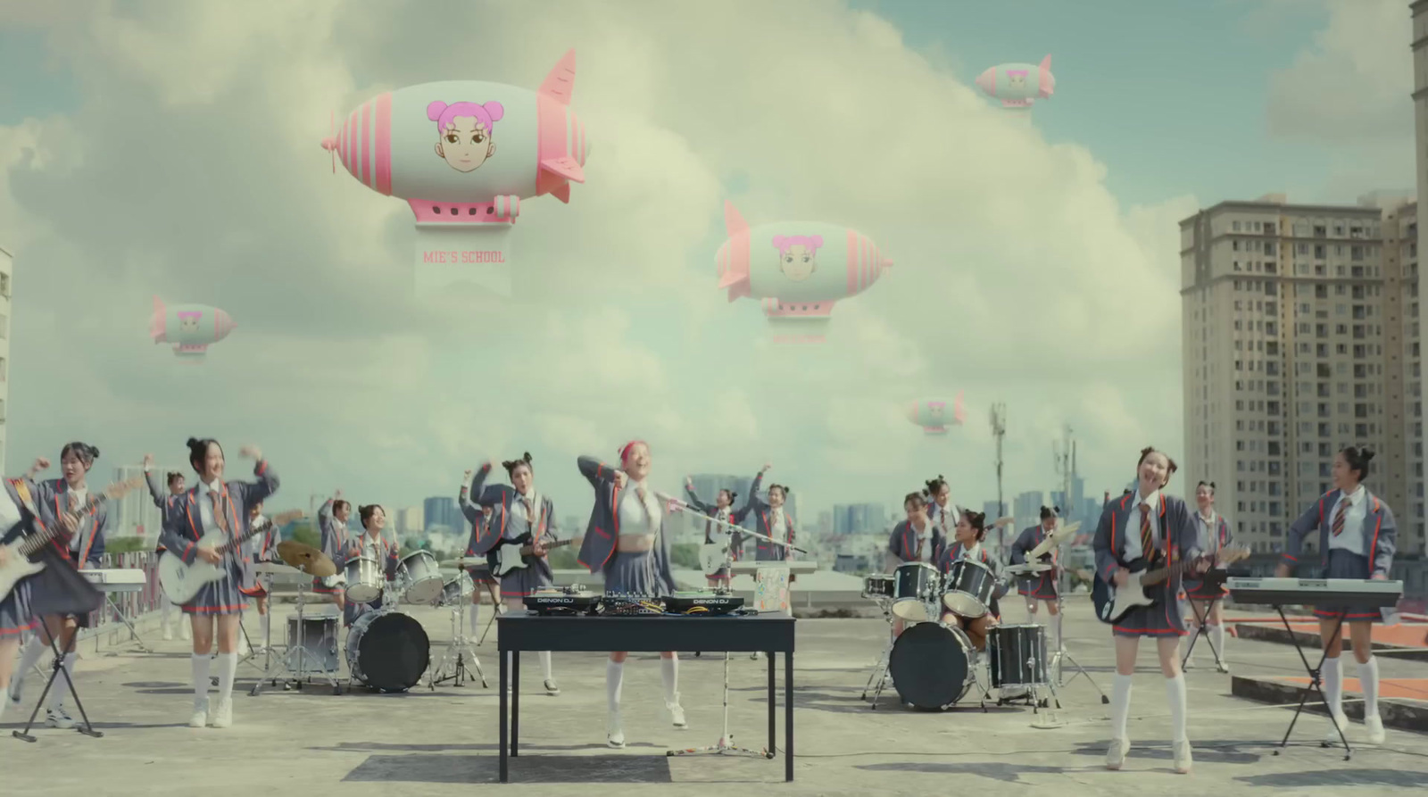 a group of people standing on top of a roof