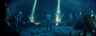 a man standing in the middle of a underwater cave