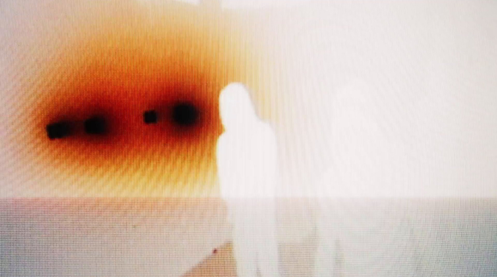 a blurry image of a person standing in a room