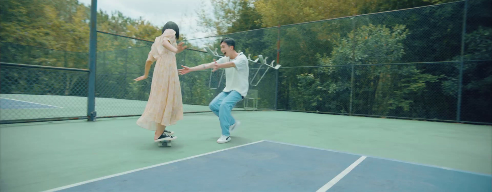 a man and a woman playing tennis on a tennis court