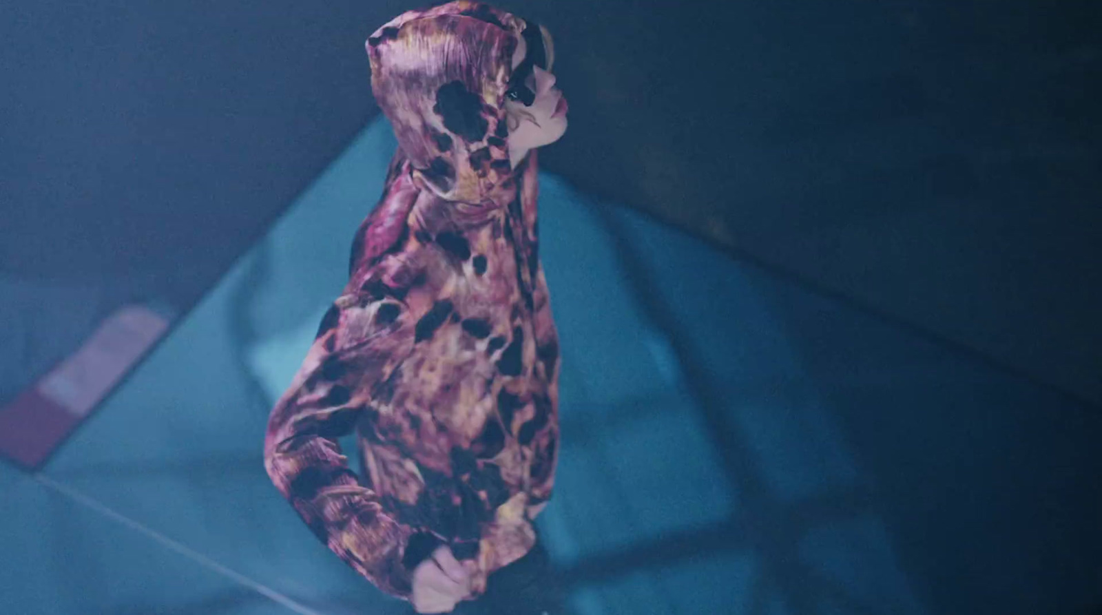 a stuffed animal sitting on top of a glass table