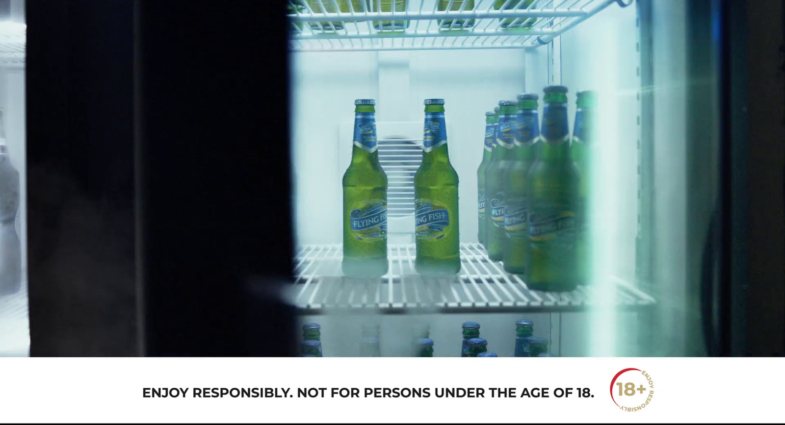 a refrigerator filled with lots of bottles of beer