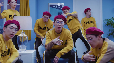 a group of young men wearing yellow shirts and red caps