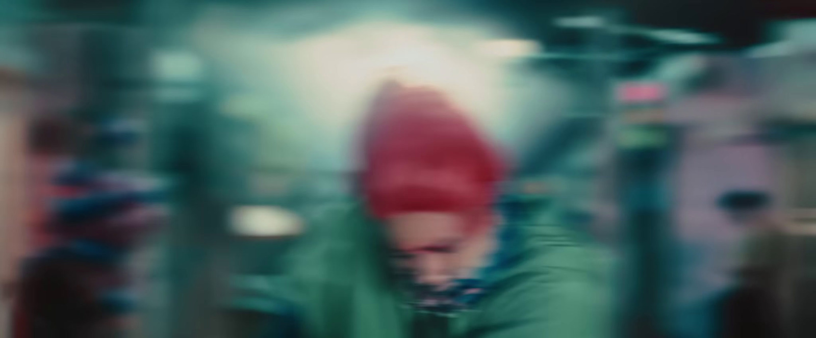 a blurry photo of a person wearing a red hat