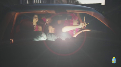 a group of people sitting in the back of a car