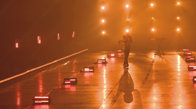 a person standing on a stage with a microphone