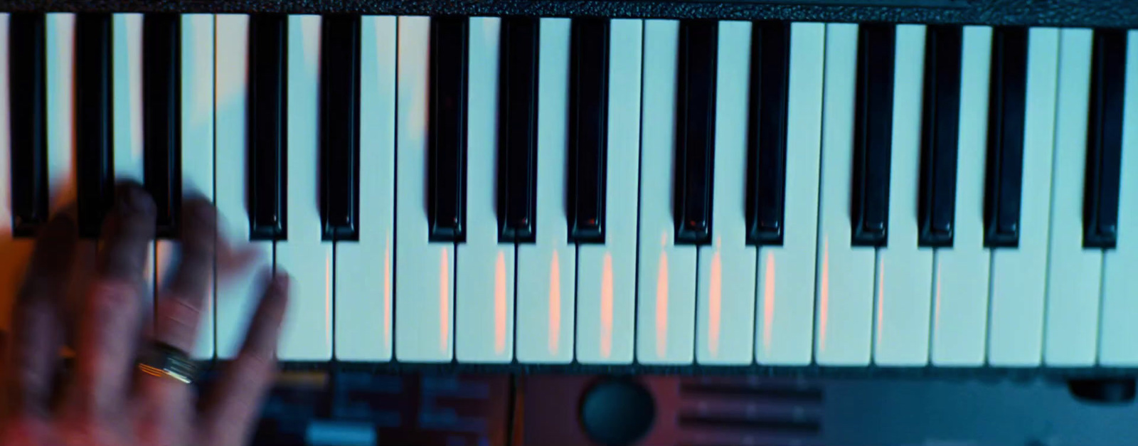 a close up of a person playing a piano