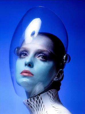 a woman with blue and white makeup and a plastic head