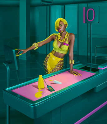 a woman in a yellow outfit is playing a game of pool