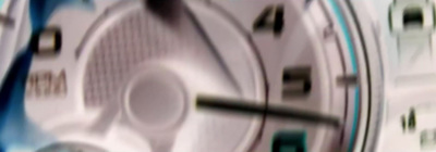 a close up of a clock with a blurry background