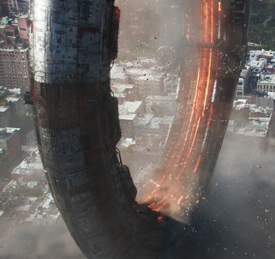 an aerial view of a city with a huge tire