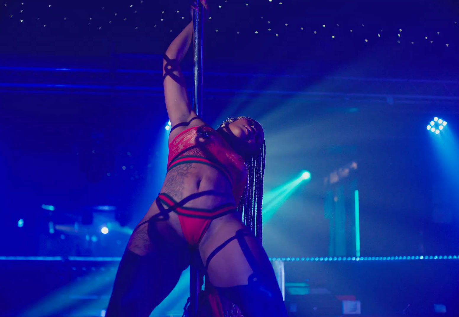 a woman in a red lingerie on a pole