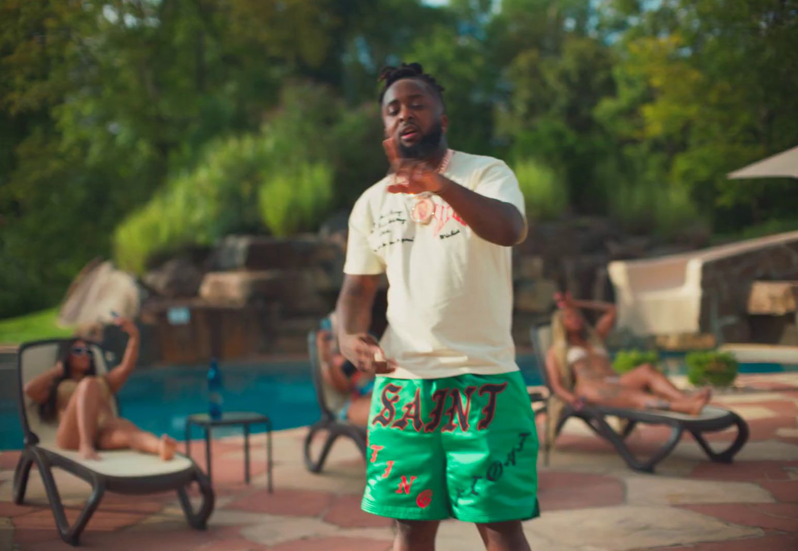 a man standing in front of a swimming pool