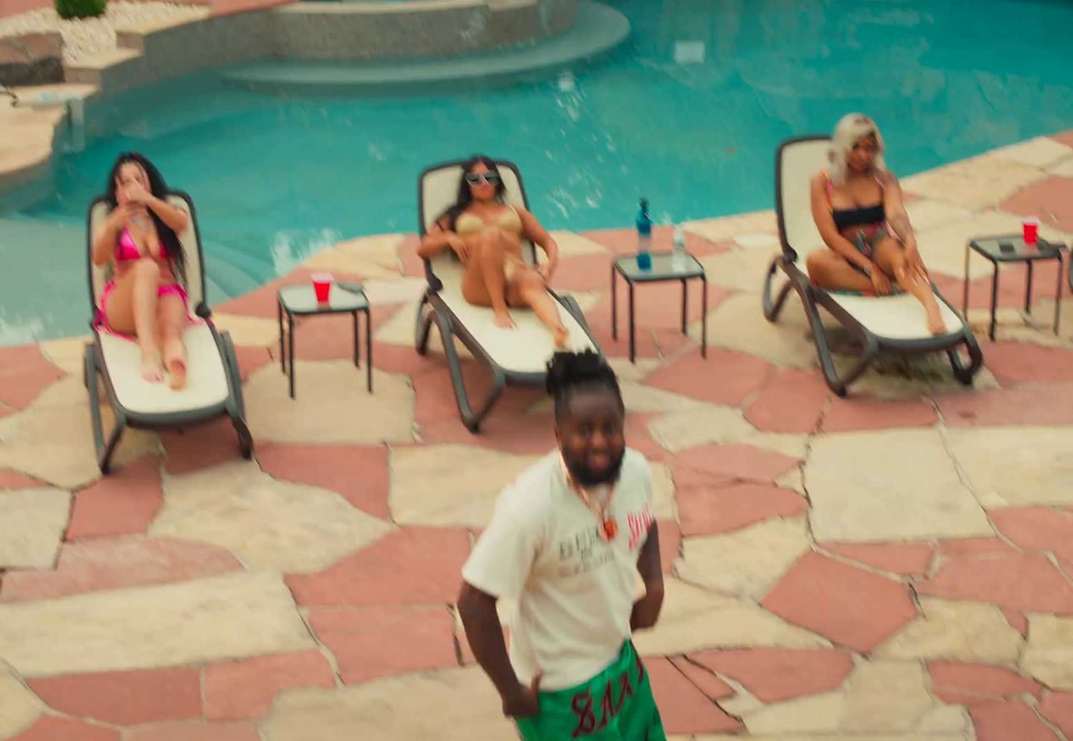 a man standing in front of a swimming pool