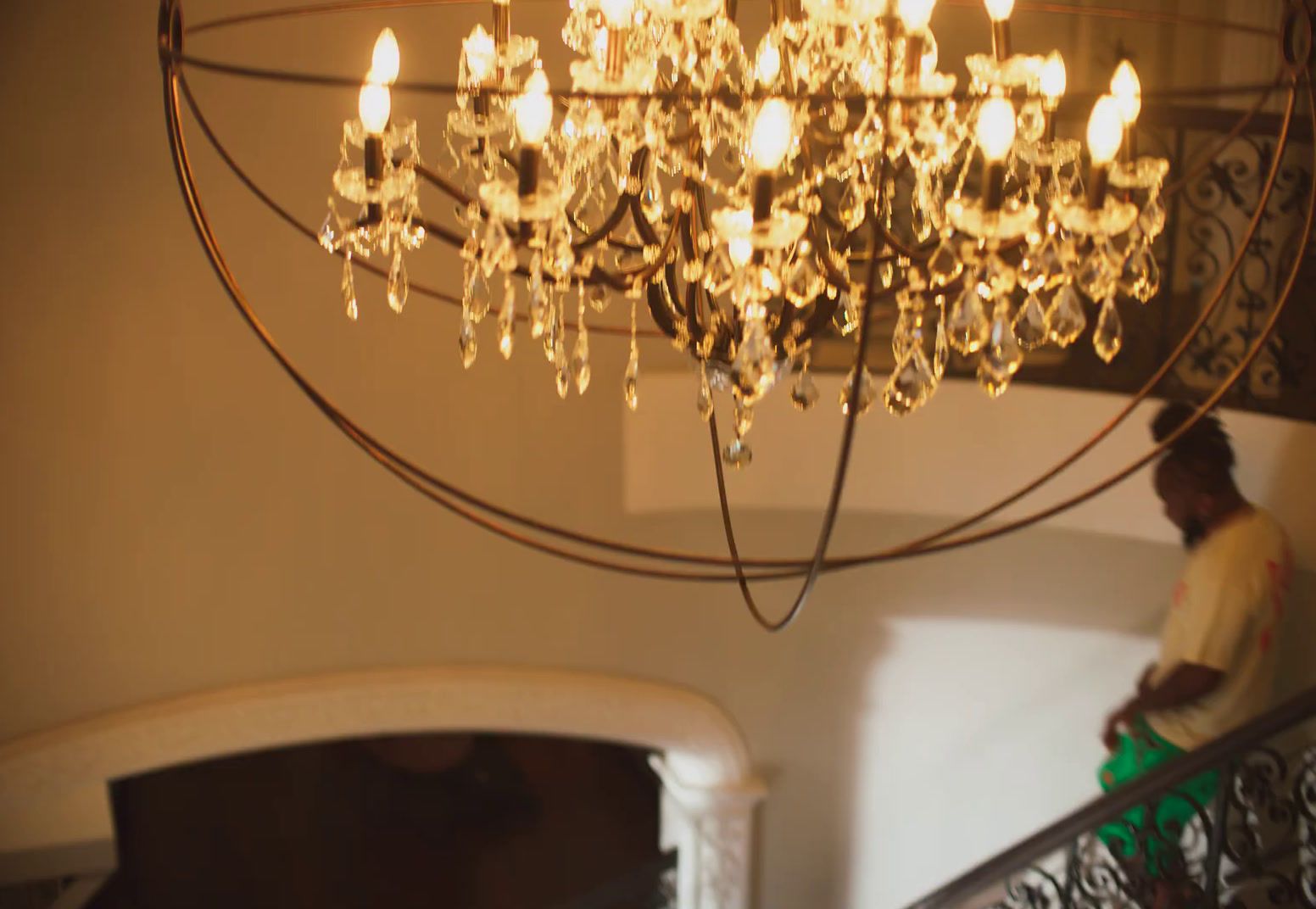 a chandelier hanging from the ceiling in a house