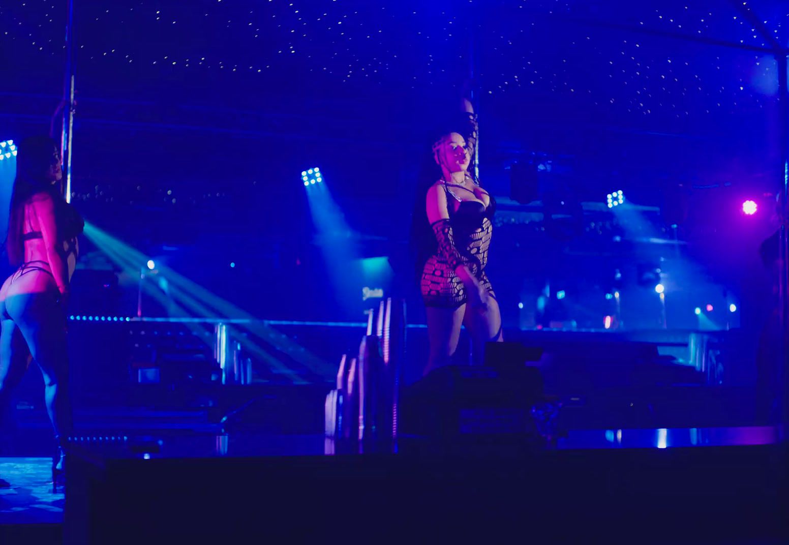 a woman standing on a stage in front of a crowd