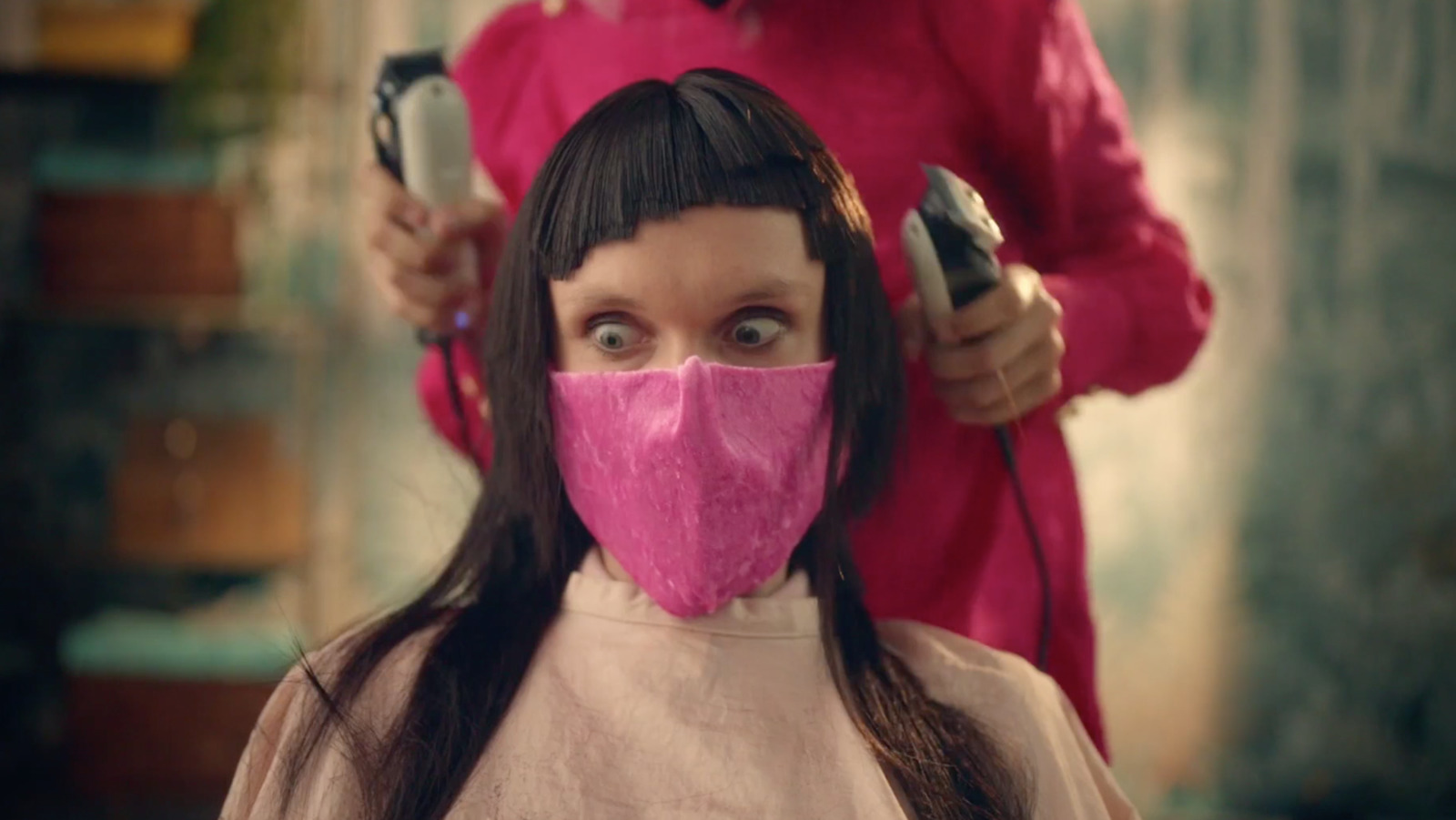 a woman with a pink mask covering her face