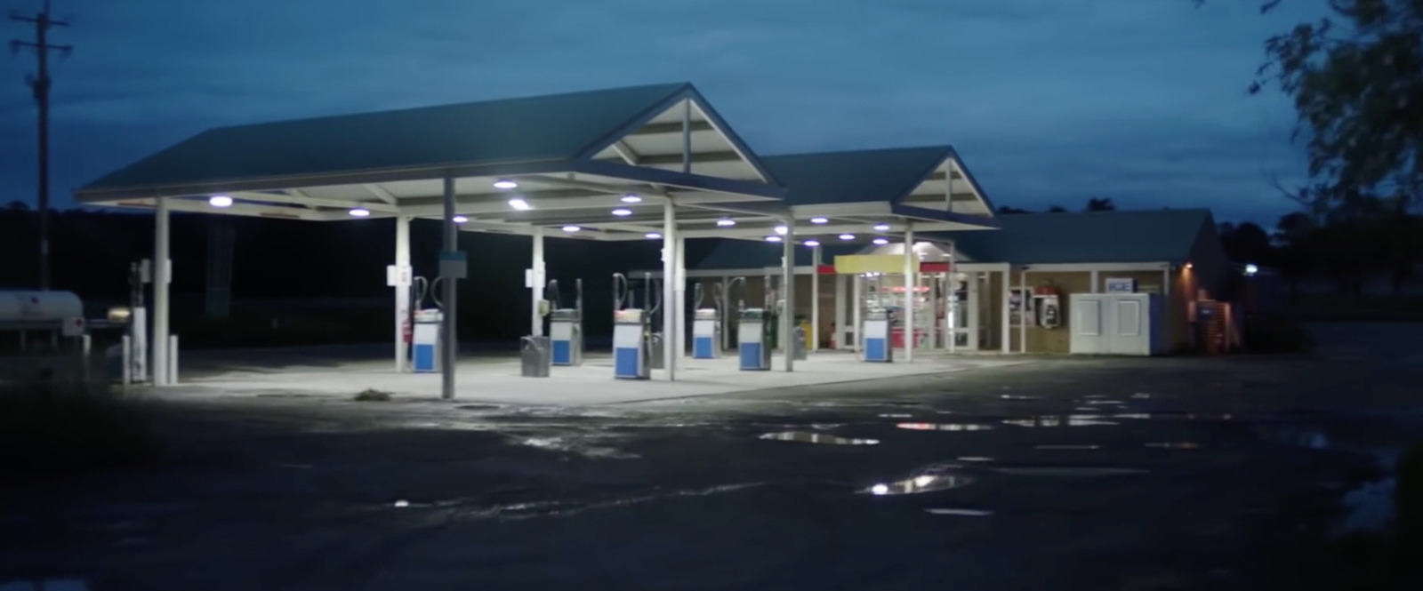 an empty gas station at night with no people