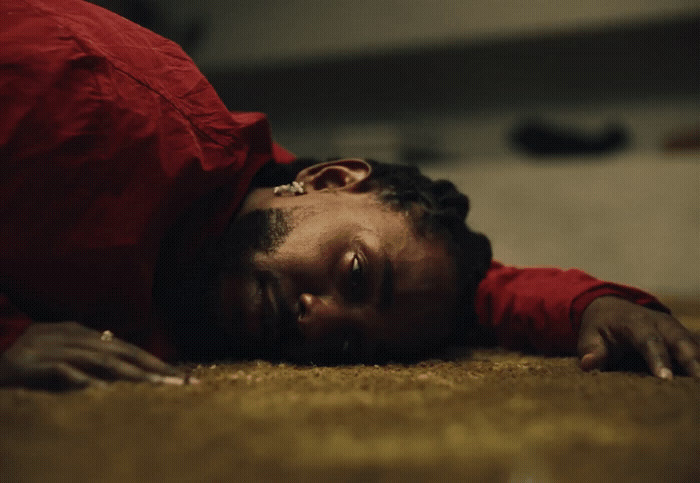 a man laying on the floor with his head on his hands