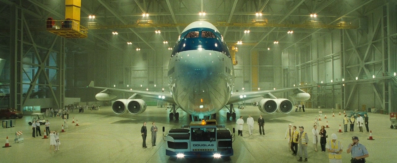 a large jetliner sitting inside of a hangar