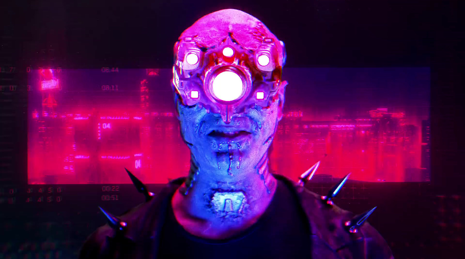 a man in a dark room with a purple light on his face