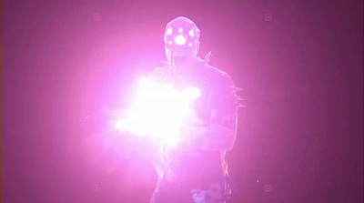 a man in a mask holding a glowing object