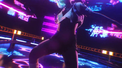 a woman is dancing on a stage with neon lights