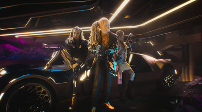 a group of women standing in front of a car