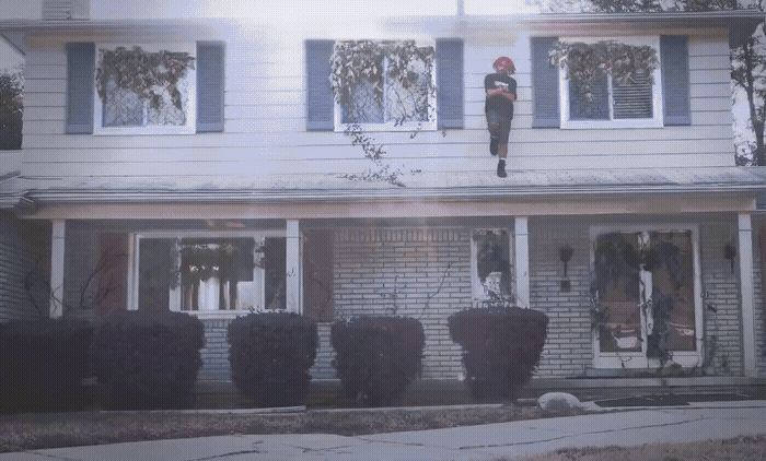 a person standing on the roof of a house